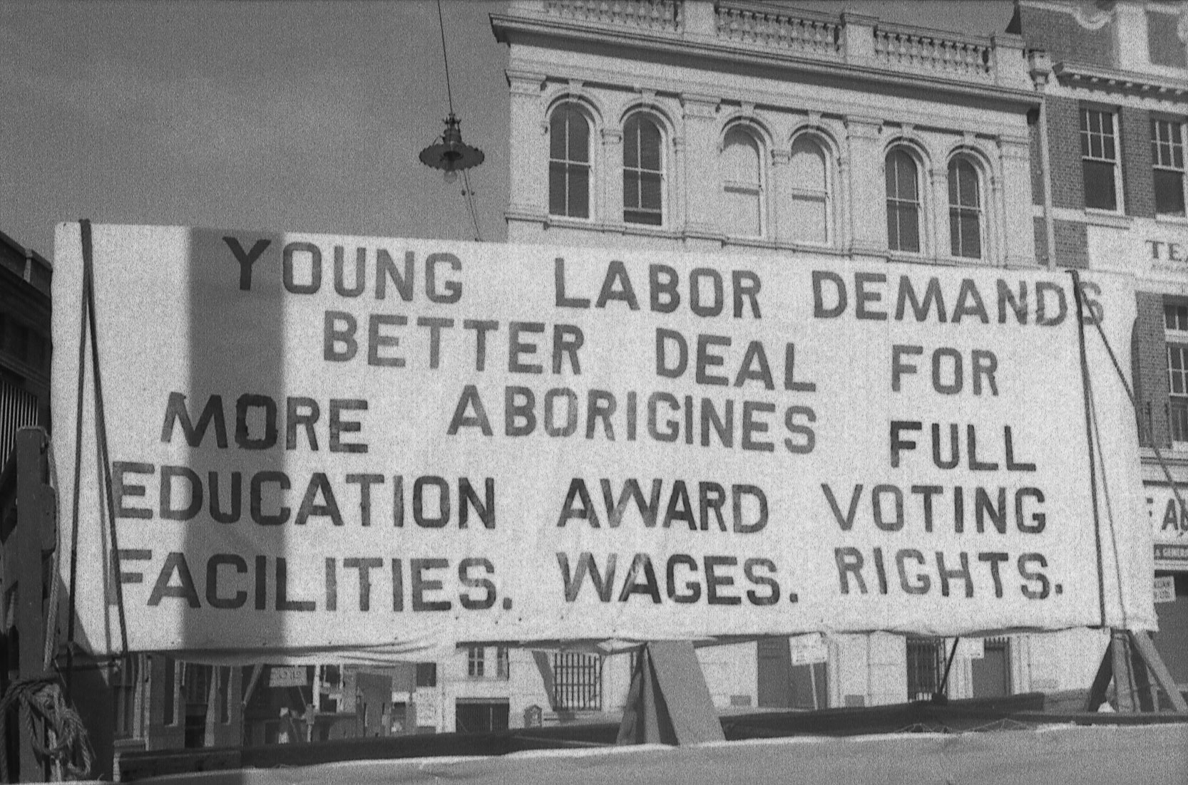 <p>Young Labor banner on Aboriginal rights, May Day procession, 1965</p>
