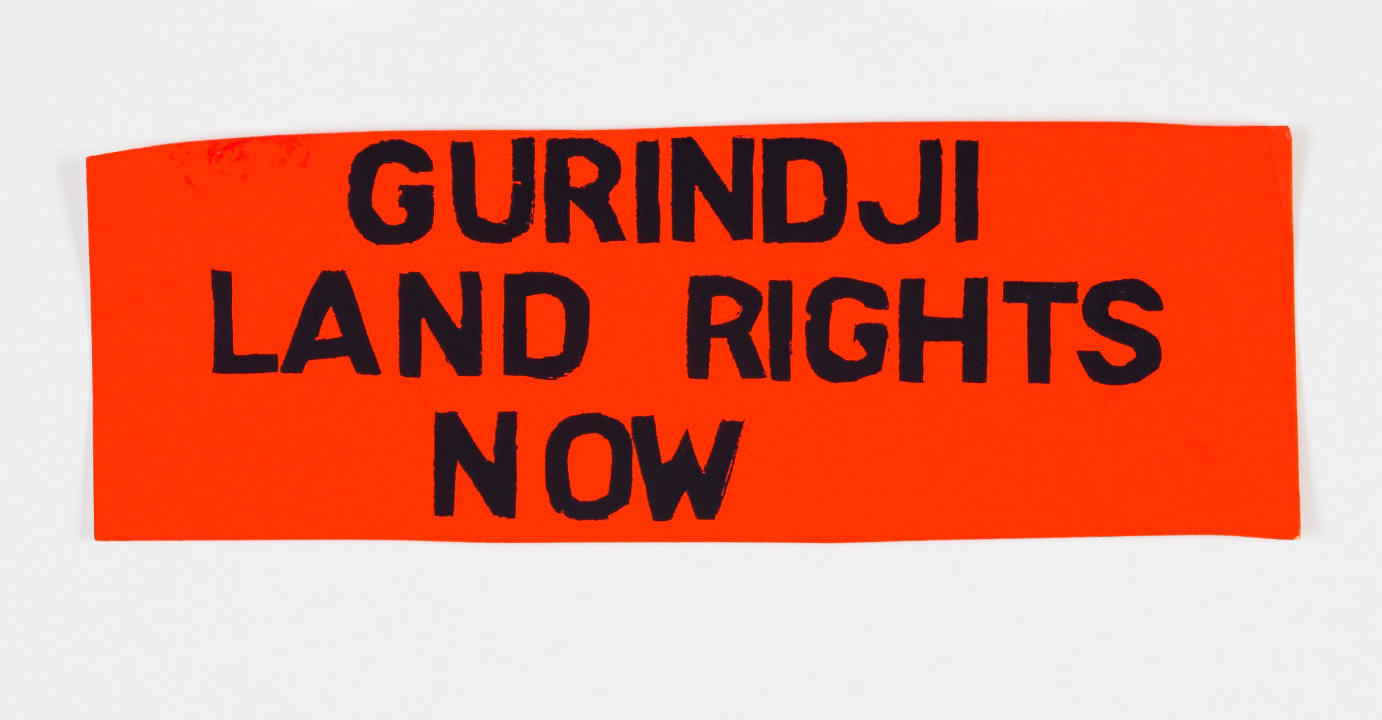 <p>A sticker reading ‘Gurindji land rights now’</p>
