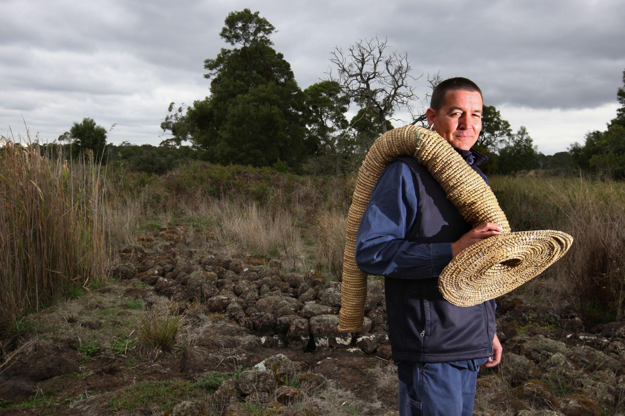 Budj Bim senior ranger Greg Shelton, carrying an eel trap.
