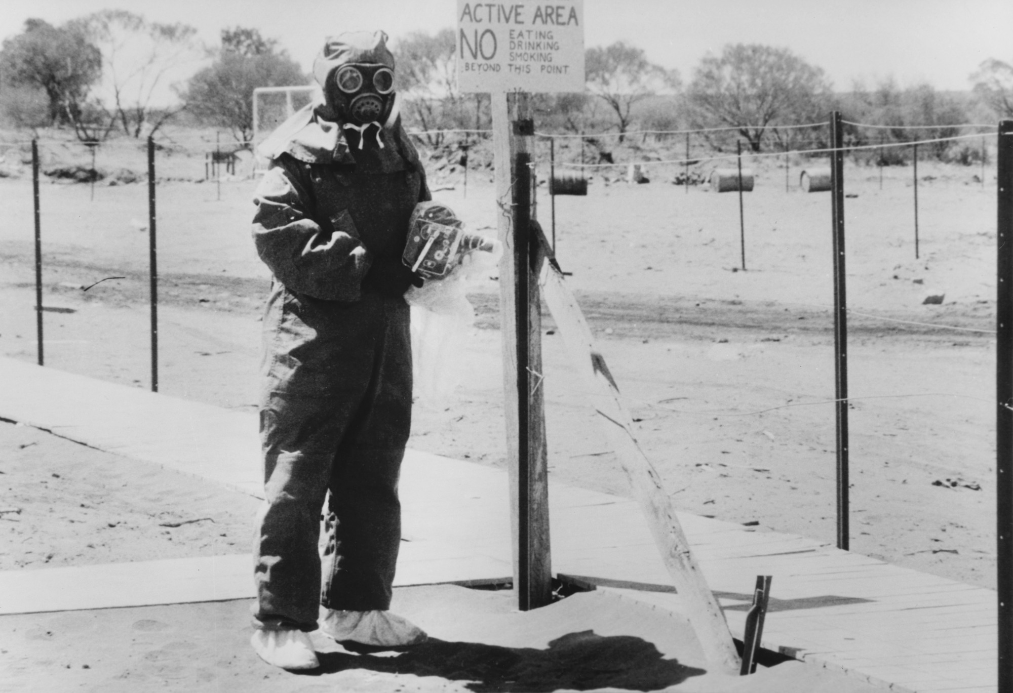 A man in protective clothing at Maralinga.
