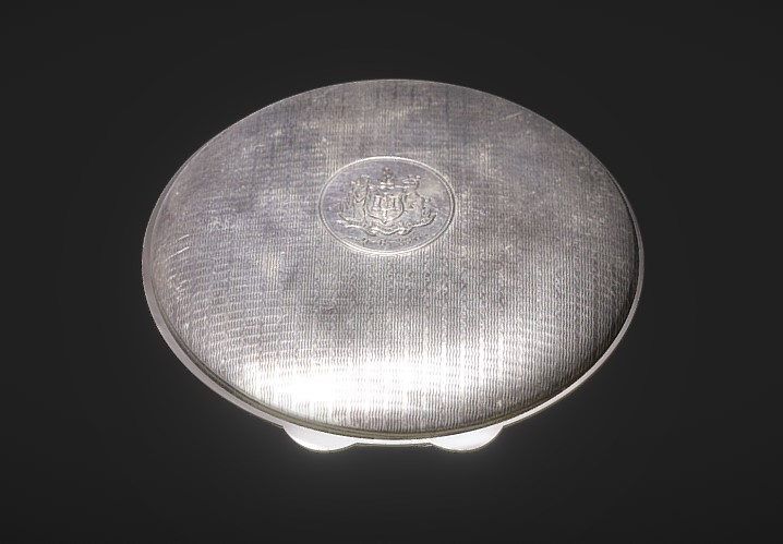 Face powder compact presented to Dame Enid Lyons