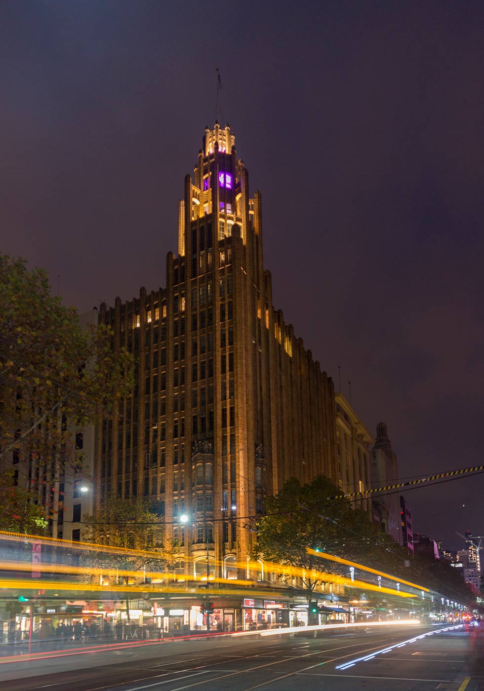 Photograph of a city building at night.