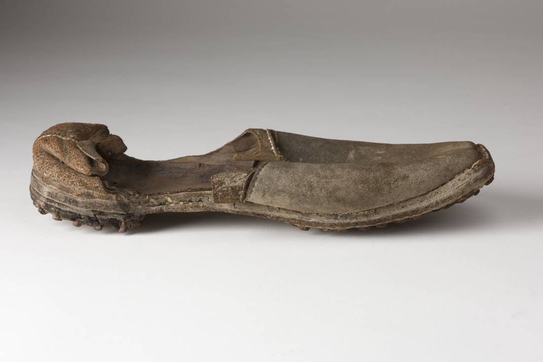 Handstitched leather shoe with iron nails in sole and heel
