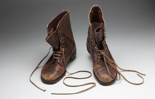 A pair of size 9, brown leather work boots, with Dunlop Australian soles and brown laces.