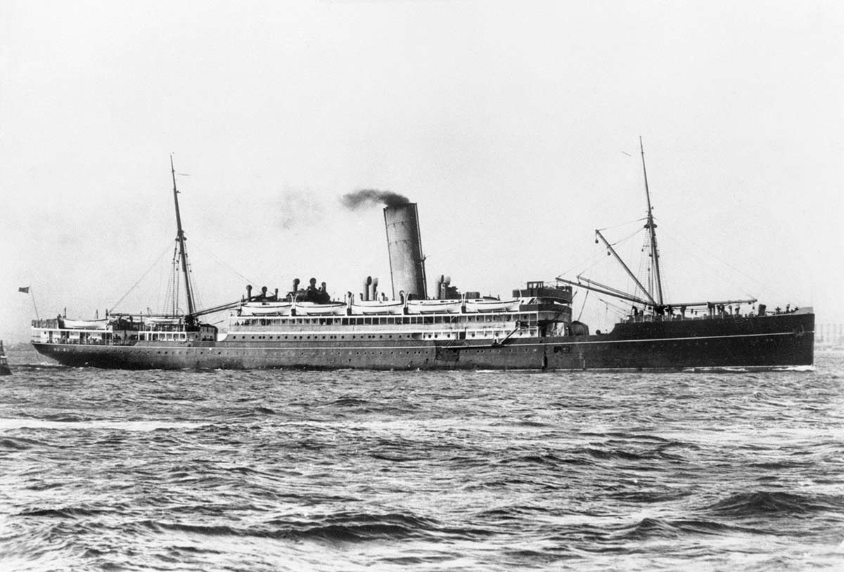 Black and white photograph of a large ocean liner at sea.