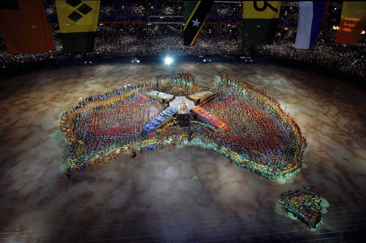Map of Australia created by a large number of performers while vast crowds watch on.