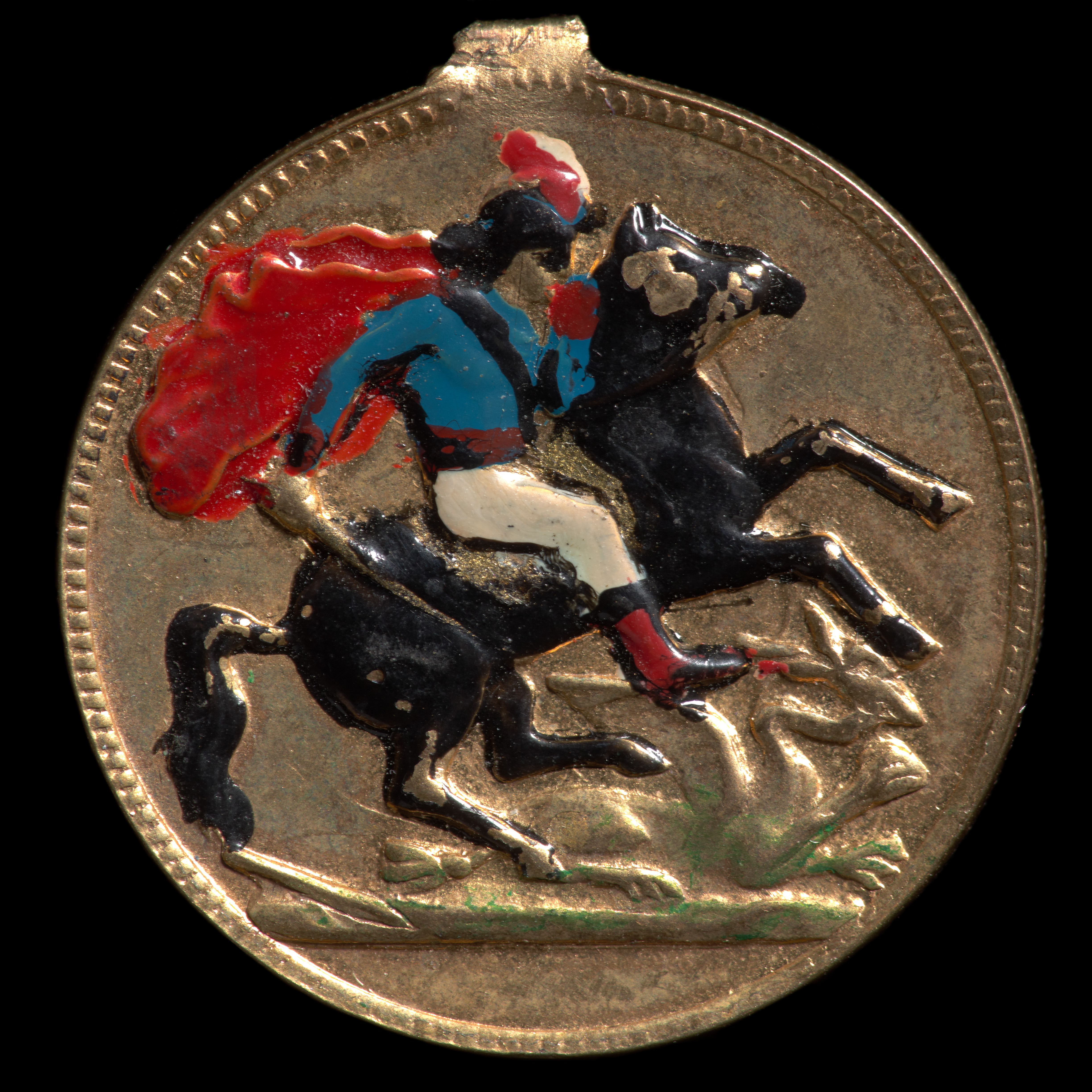  A circular, handpainted metal coin. The coin is gold coloured with a stippled rim. There is an area of damage on the rim causing it to protrude from the rest. One face is overpainted with a figure on horseback wearing white pants, a blue top and a red cape.