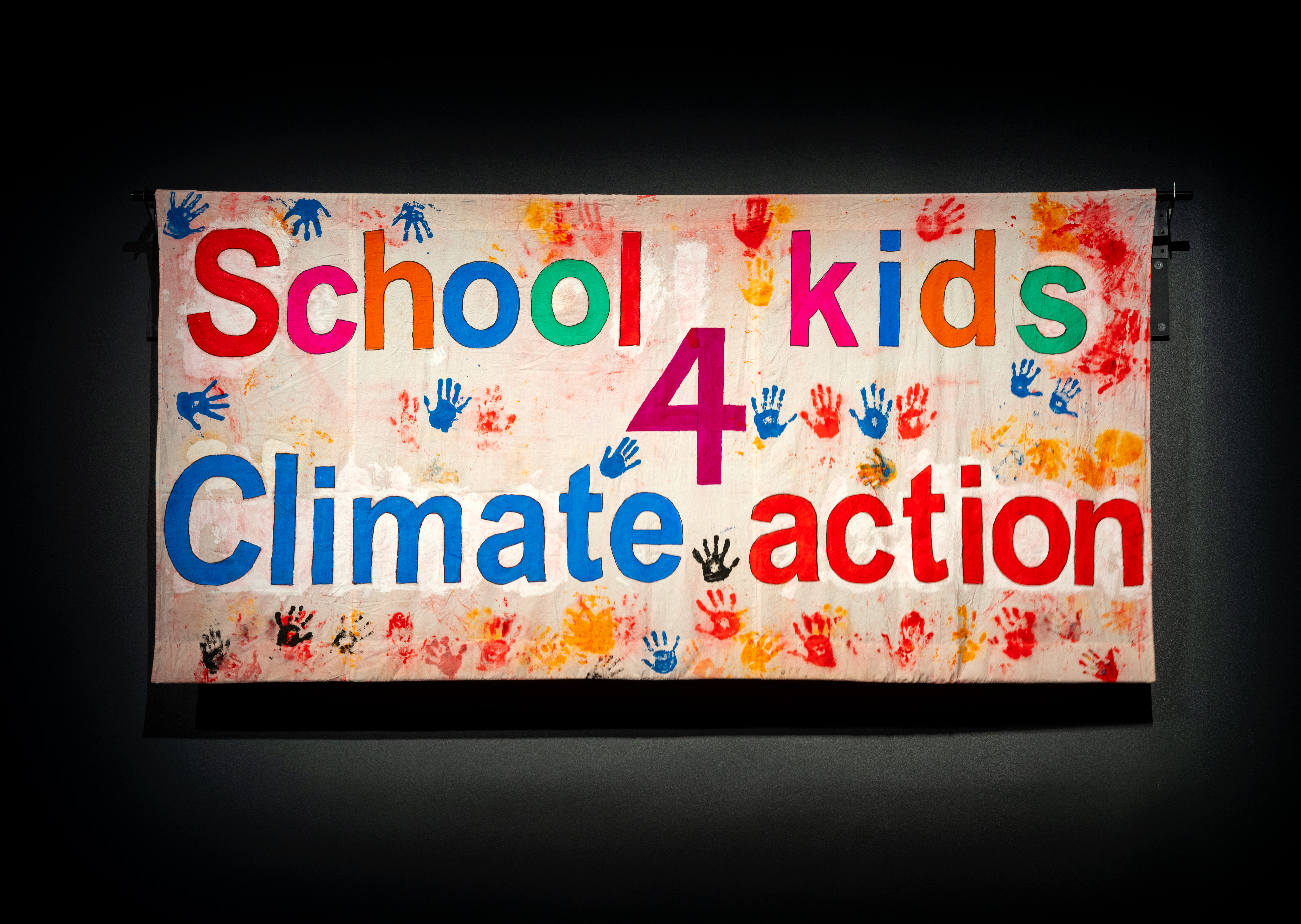 Banner for climate strike with handprints from children. 