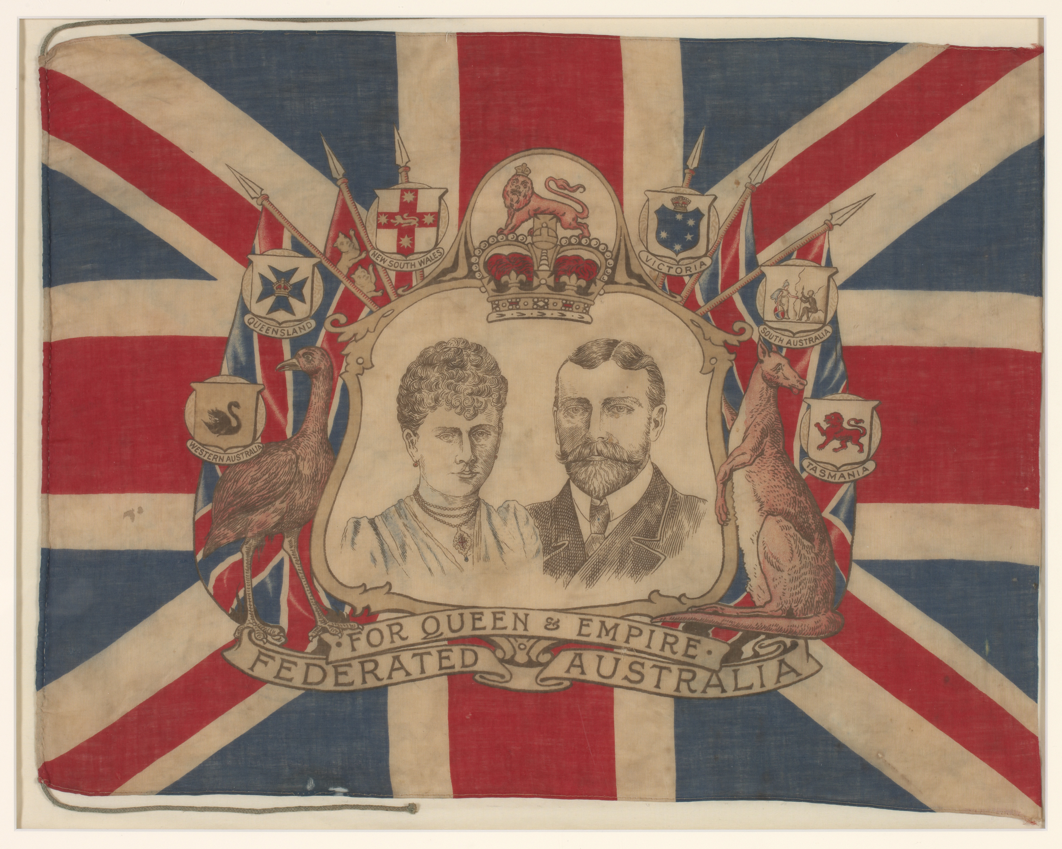  An invitation on thick cardboard that reads 'THE GOVEREMENT OF VICTORIA requests the honor of the presence of / Mr & Mrs E. W.Whereat / at a Conversazione in the Exhibition Building on the Evening of Tuesday 7th May 1901, at 8 p.m.'. The invitation has an illustration of the Royal Exhibition building in the centre and a border that is highly decorated with scenes of five Australian capital cities as well as shields, and Australian flora and fauna.