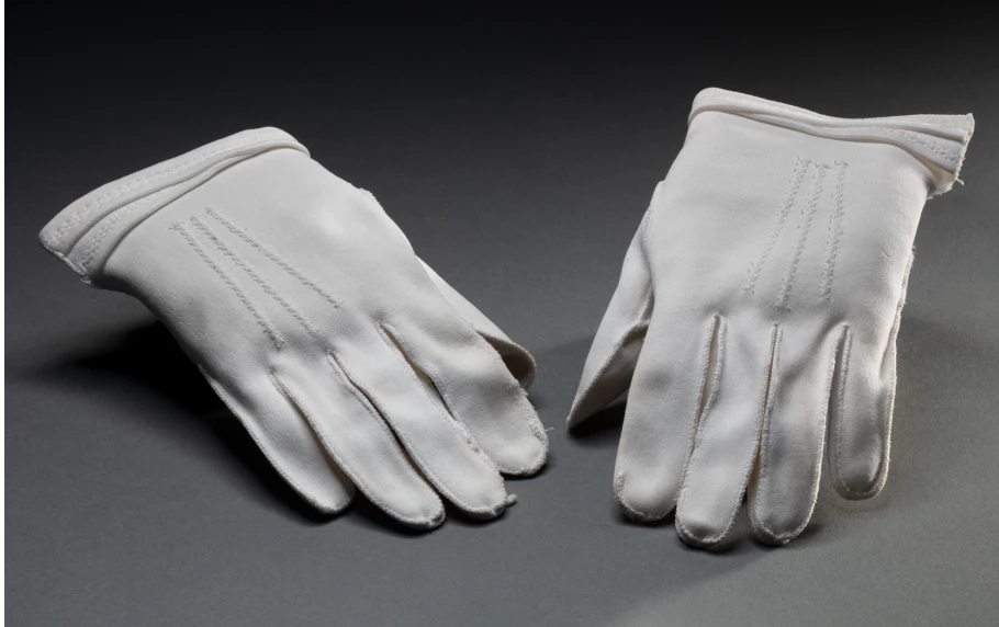 Pair of short white cotton gloves worn by Aboriginal rights activist Faith Bandler.