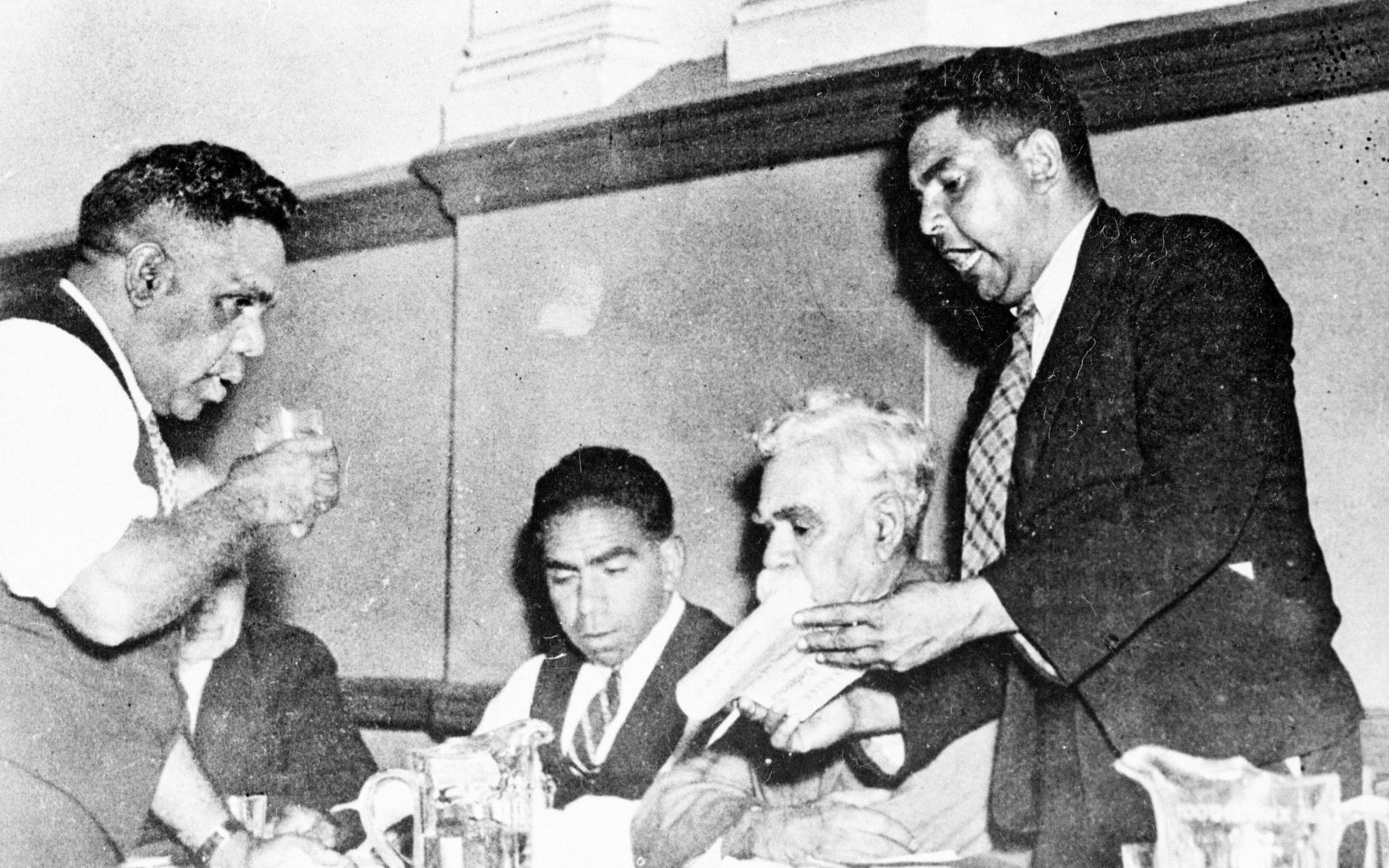 Aboriginal rights activists Tom Foster, Jack Kinchela, Douglas Nicholls, William Cooper and John Patten discuss a resolution, 1938.