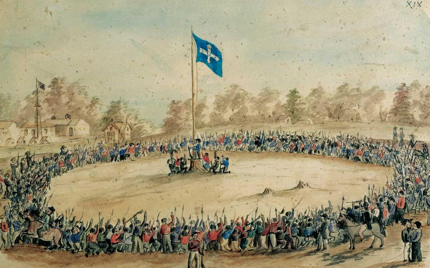 Hundreds of men encircle flag pole with Eureka flag at the top.